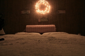 Chenille bedspread-thrifted.IKEA lighted wreath. Cozy.
